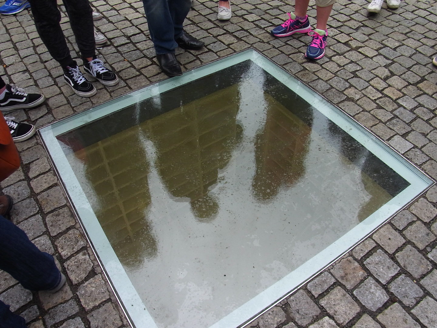 A memorial to the Nazi book burning by Micha Ullman set into the Bebelplatz.