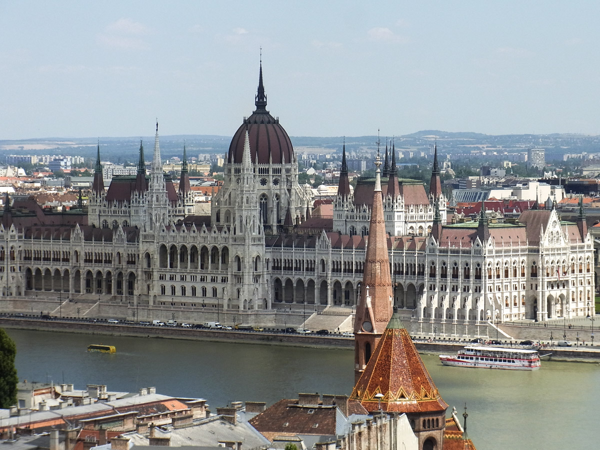 Looking across Szilágyi Dezső téri református templom (Calvinist Church), the Danube to the Parliament
